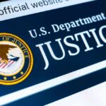 Close-up of the U.S. Department of Justice logo on a website