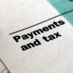 Close-up of a financial document highlighting the Payments and tax section