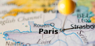 Close-up of a map highlighting Paris with a location pin