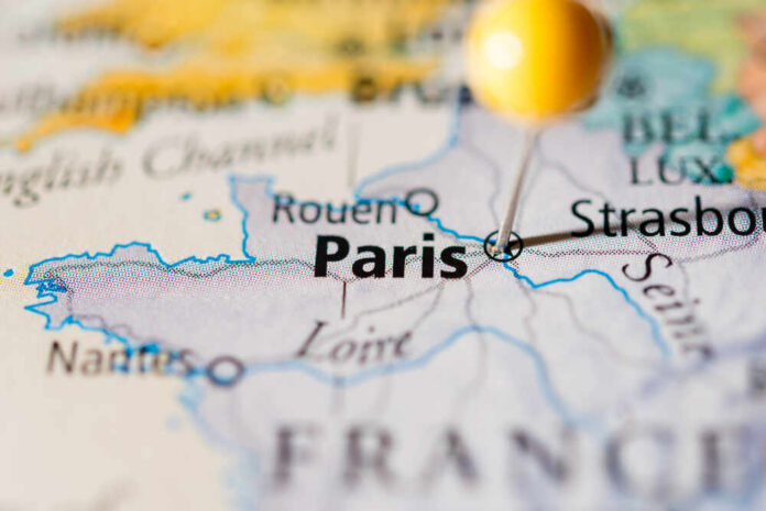 Close-up of a map highlighting Paris with a location pin