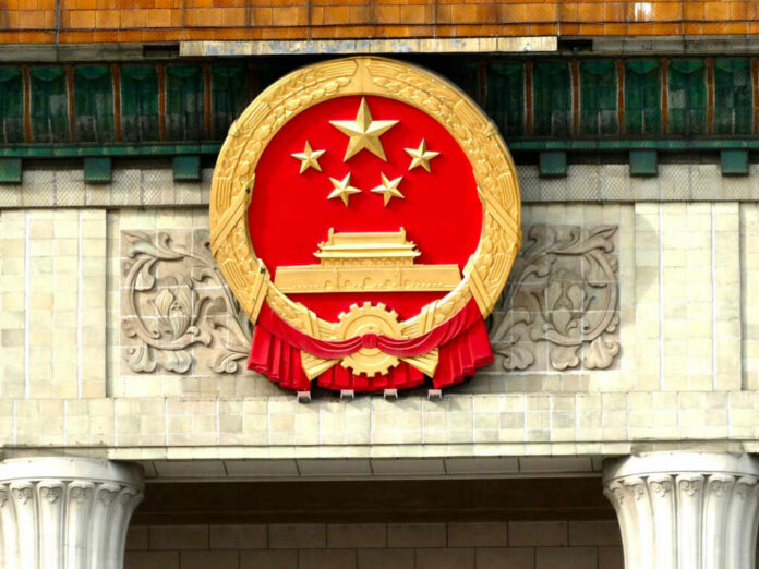 National emblem of China displayed on a government building