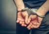 Killer Baker’s DARK Secrets: Chilling Confession! Hands cuffed behind the back, symbolizing arrest