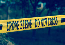 Manager Job Lure Ends in Tragedy — Stunning Twist! Yellow crime scene tape reading DO NOT CROSS