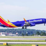 A Southwest Airlines airplane taking off from an airport runway