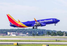 A Southwest Airlines airplane taking off from an airport runway