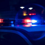 Close-up of police car lights flashing at night