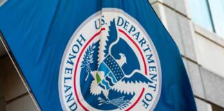 Flag of the U.S. Department of Homeland Security displayed on a building