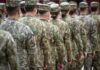 Candidate’s ‘Dark Time’ Excuse Fails – Veterans ANGRY Line of soldiers in camouflage uniforms standing in formation