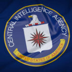 CIA emblem featuring an eagle and a compass rose on a blue background