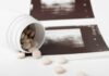 Spilled pills beside medical imaging prints