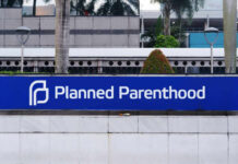 Sign for Planned Parenthood located in an urban area
