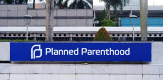 Sign for Planned Parenthood located in an urban area