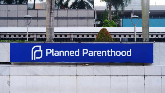 Sign for Planned Parenthood located in an urban area