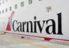 Carnival Horizon cruise ship docked near a city skyline