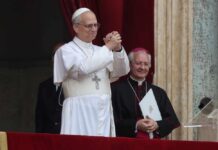 Anthropic Co-Founder Joins Pope—Church’s Moral Voice at Risk? A religious leader in white robes gestures during a public address