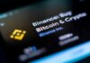 Close-up of the Binance app interface displaying Bitcoin and cryptocurrency options