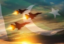 Three fighter jets fly in formation over a sunset sky with a flag overlay
