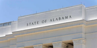 Alabama’s Map Slammed as ‘Intentionally Discriminatory’ Facade of a government building with the words 'STATE OF ALABAMA' displayed prominently