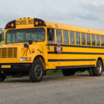 A yellow school bus parked on a road