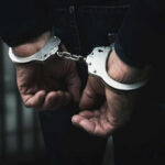 Hands in handcuffs behind the back