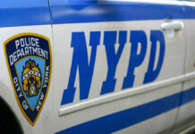Crime Wave Clashes With Anti-Cop Chorus Close-up of a New York Police Department vehicle with badge and NYPD lettering