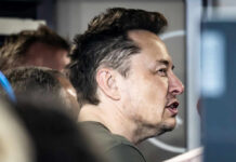 Close-up of a man engaged in conversation indoors