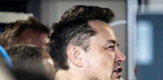 Close-up of a man engaged in conversation indoors