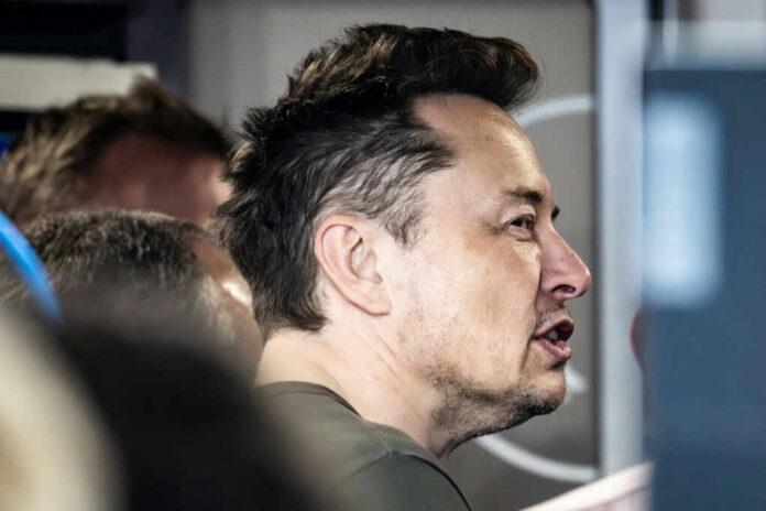 Close-up of a man engaged in conversation indoors