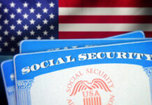 Social Security cards in front of the American flag