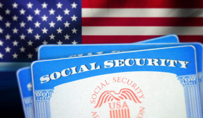 Social Security cards in front of the American flag