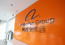 Pentagon Dragged to Court — By Alibaba Press podium with microphones and an American flag in the background