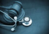 Elijah McClain Convictions Thrown Out Over Major Legal Error A wooden gavel next to a stethoscope on a dark surface