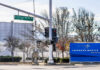 Pentagon Pipeline Moves Into Detroit Sign for Lockheed Martin Space Systems next to a traffic signal