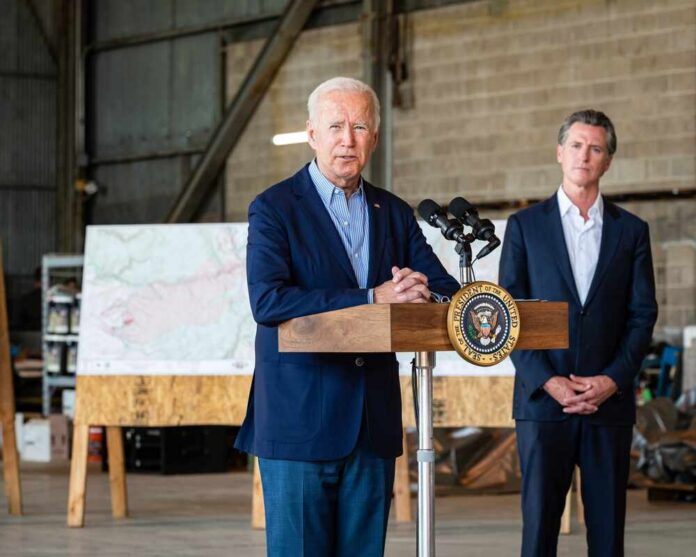Sacramento,,Ca,,Us.a.,-,Sept.,13,,2021:,President,Biden,Speaks Interior of a circular government chamber with a decorative ceiling and state seal on the floor