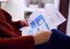 Nevada Utility Targets Home Electricity Use With New Charges Person reviewing an energy bill with detailed information
