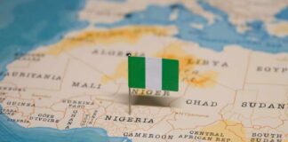A small Nigerian flag placed on a map of Africa