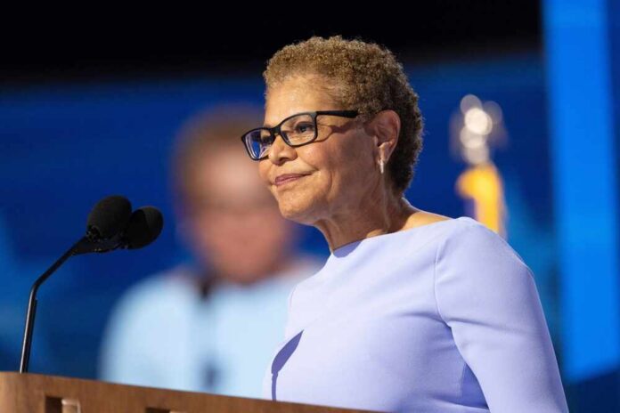 Chicago,,Illinois,,August,19,,2024:,Los,Angeles,Mayor,Karen,Bass A woman in a light blue dress speaking at a podium with a microphone