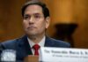 Democrat Storms Out of Hearing—Rubio: “Why Is She Leaving?” A government official sitting at a hearing with a serious expression