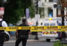 Deadly Crash Exposes NYC’s Scooter Law Mess Police officers near a crime scene marked by caution tape