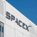 Falcon 9 Turns Space Into An Assembly Line SpaceX logo on a white industrial building facade