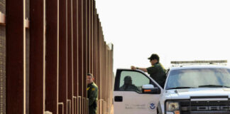 Border Chaos: Packed Rig Blows Past Checkpoint U.S. Customs and Border Protection officers near a border fence