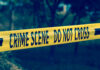 Sheriff Denies Crime — Family Smells Cover-Up Yellow crime scene tape reading DO NOT CROSS