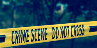 Sheriff Denies Crime — Family Smells Cover-Up Yellow crime scene tape reading DO NOT CROSS