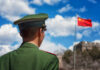 Airpower Math Twist — China Closes Fast A Chinese soldier in uniform standing in front of the Great Wall and the national flag
