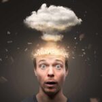 Surprised man with exploding head concept and cloud above