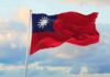 Taiwan flag waving against a cloudy sky