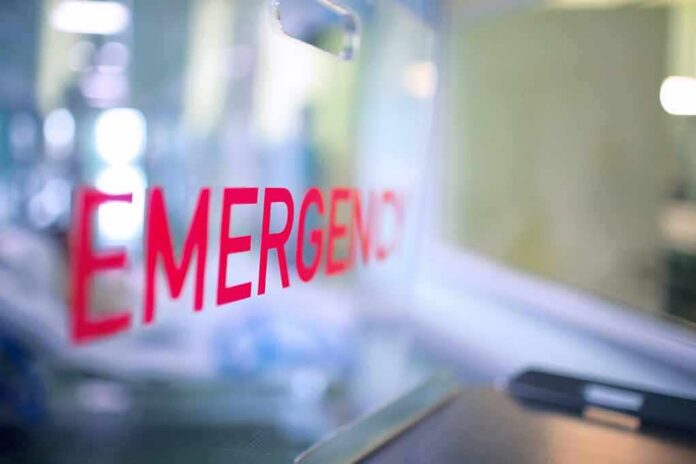 shutterstock_1879006621 Emergency room entrance sign in red letters