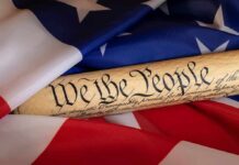 Progressives Plot Rewrite Of 1776 United States Constitution scroll on American flag