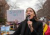 AOC’s Accent Hijacks Memphis Firestorm woman speaking into a microphone at an outdoor protest