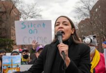 AOC’s Accent Hijacks Memphis Firestorm woman speaking into a microphone at an outdoor protest